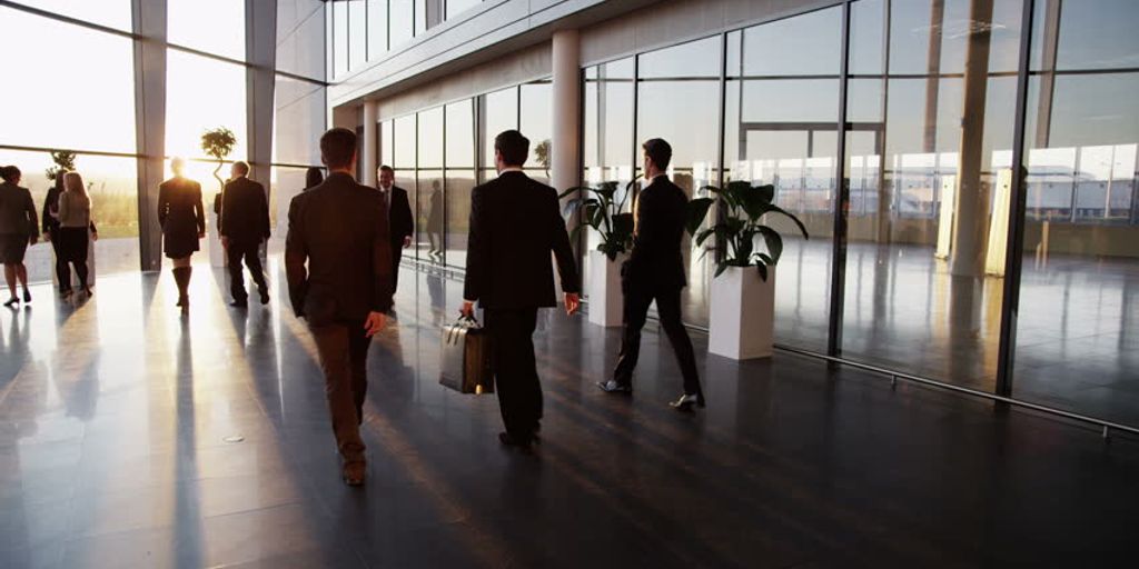 business professional shaking hands in a modern office